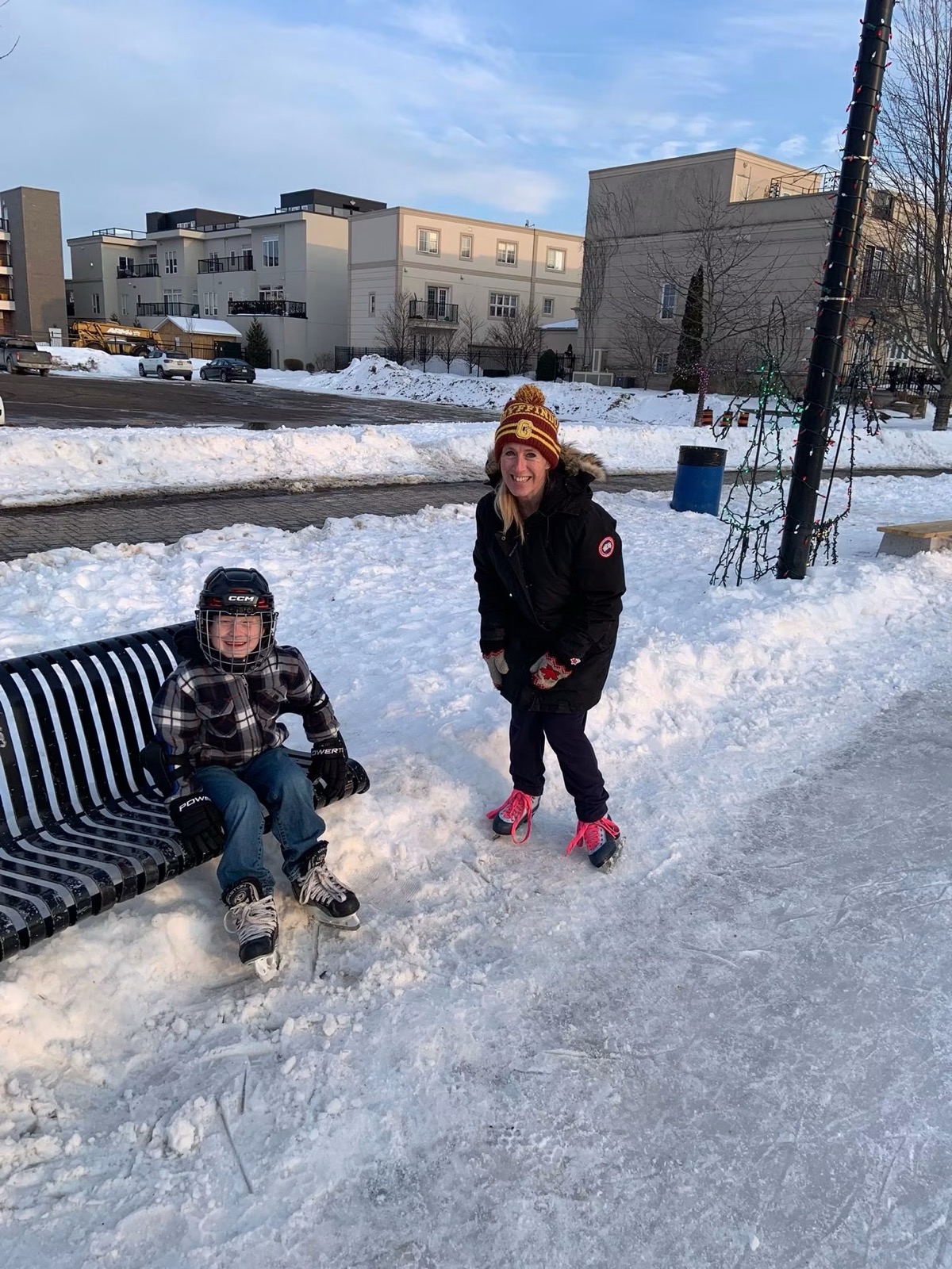 Lindsay Grimley skating with her son at the community outdoor rink